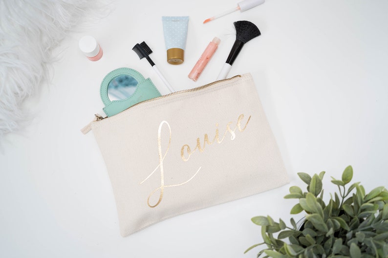 Cream cotton canvas make up with a sturdy zip and personalisation in gold foil.