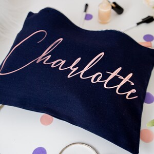 Black cotton canvas make up bag with a sturdy zip and personalisation in a rose gold foil.