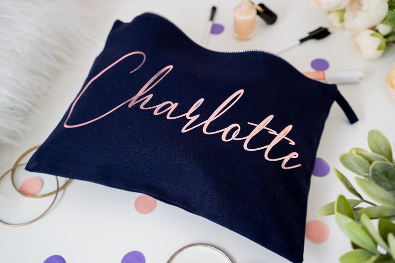 Black cotton canvas make up bag with a sturdy zip and personalisation in a rose gold foil.