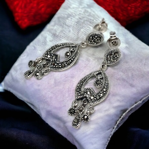 Earrings on grey gown best sale