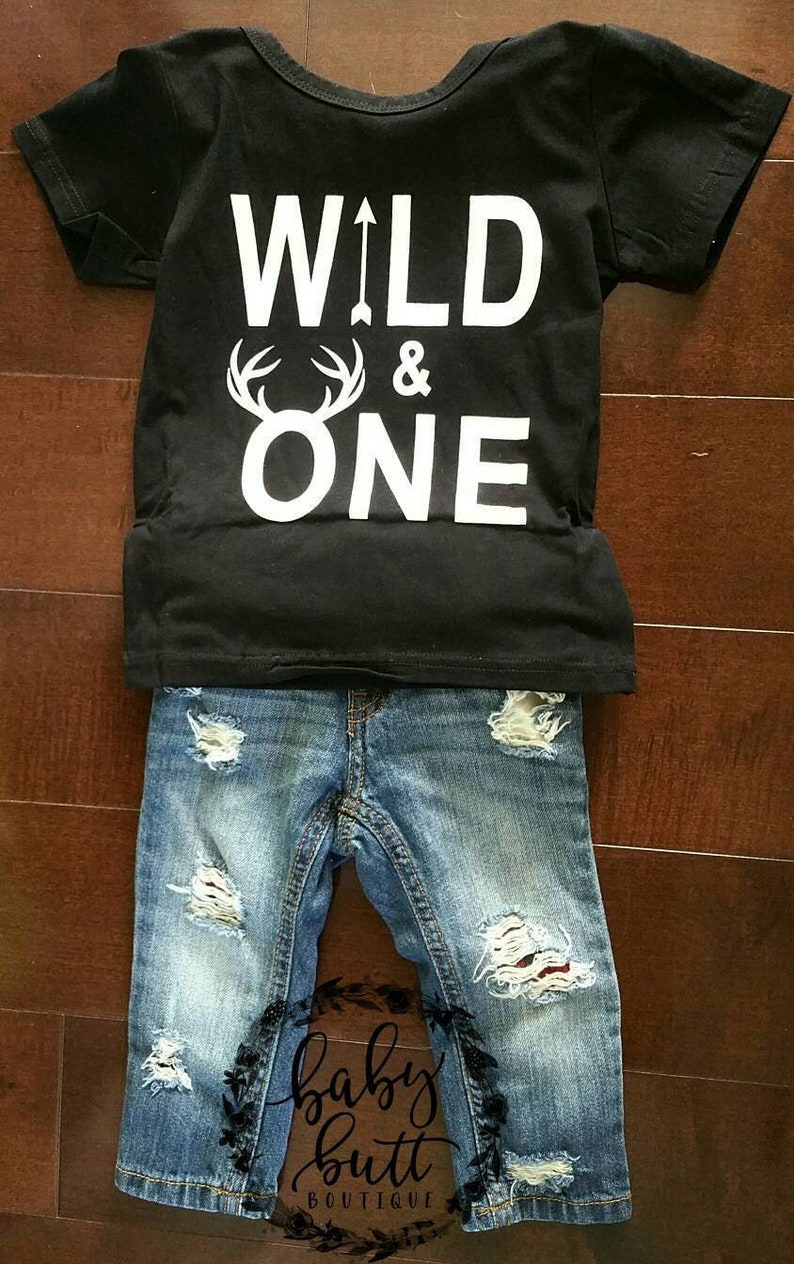 Wild one buffalo plaid distressed patched jeans outfit for country boy first birthday.Wild one red plaid first birthday photo outfit.