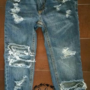 baby boy cut up jeans