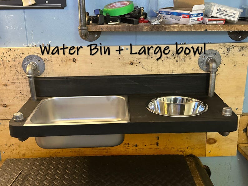 Floating water bin dual feeder: steampunk pet feeding station with two stainless bowls on a wooden platform beside a dog.