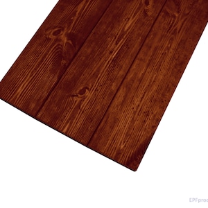 May include: A close-up of a dark brown wooden surface with a natural wood grain pattern. The wood has a smooth, polished finish.