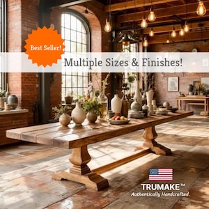 May include: A large, rectangular wooden dining table with a warm, natural finish. The table features a pedestal base and is surrounded by decorative vases and plates. Text on the image reads "Multiple Sizes & Finishes!" and "Best Seller!"