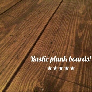 May include: Close-up of rustic plank boards with a warm brown tone. The boards have visible wood grain and knots, with the text "Rustic plank boards!" and five white stars.