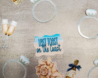 May include: A set of printable party decorations for a bachelorette party. The decorations include champagne bottles, seashells, rings, and a sign that says "Last Toast on the Coast".