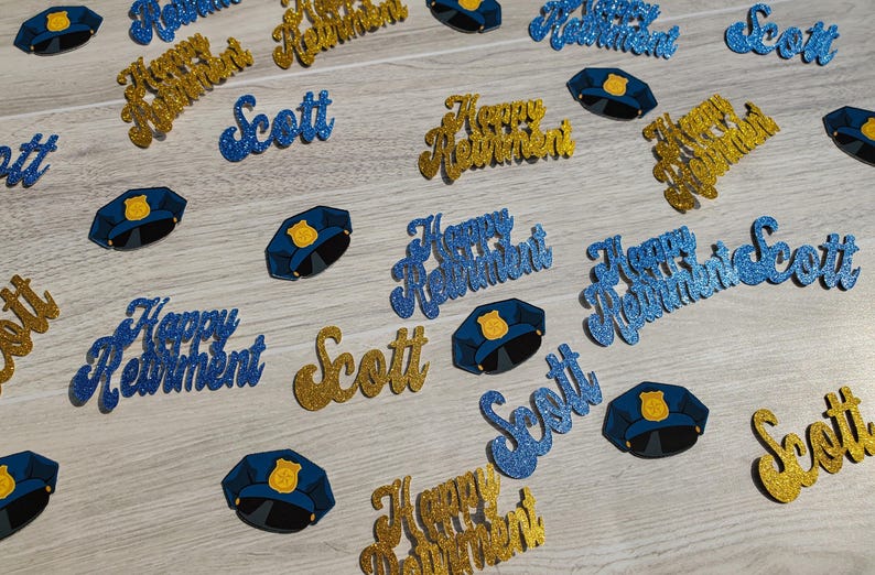 May include: Blue and gold glitter confetti with the text "Happy Retirement" and "Scott". There are also blue glitter police officer hats.