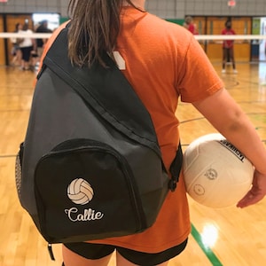 Sling Backpack with custom embroidery volleyball design.