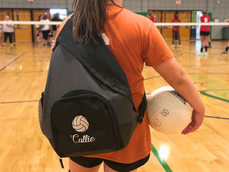 Sling Backpack with custom embroidery volleyball design.