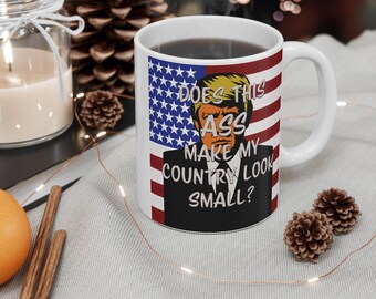 Does this ASS make my country look small Mug. 11oz. mug. With watercolor howling wolf. 11 oz. mug. Perfect for making a statement
