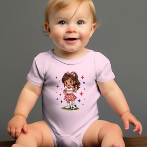 Baby in pink onesie with Croatia soccer theme and smiling face.