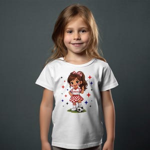 Young girl in Croatia soccer t-shirt with checkered skirt and soccer ball.