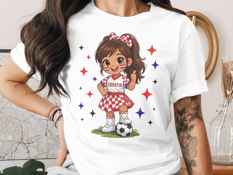 Cartoon girl in Croatia soccer uniform with ball and thumbs up.