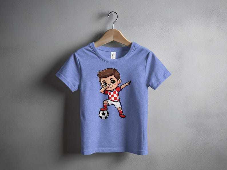 Cartoon boy in Croatian soccer jersey dabbing with ball.