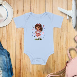 Light blue baby onesie with a cartoon girl playing soccer.