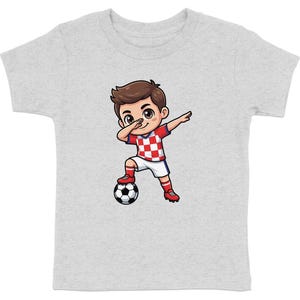 Cartoon boy in Croatian soccer uniform dabbing with ball.