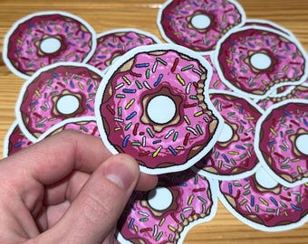 Roze donut gestanste vinylstickers. Water- en zonlichtbestendig