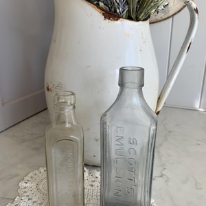 2 Antique advertising bottles