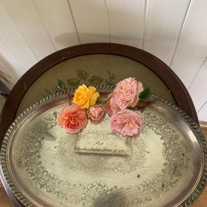 May include: A silver oval serving tray with an ornate design and a handwritten inscription that reads "Pat from the children Harris of 3/81 1774-84".  The tray is decorated with pink and yellow roses.