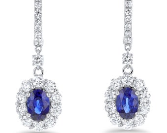 18K Gold Sapphire And Diamond Halo Dangle And Drop Earrings. Oval Shaped Sapphire And Diamond Halo Dangle And Drop Earrings. Gold Earrings.