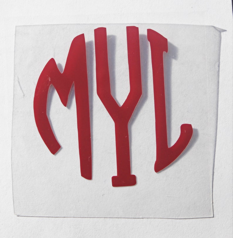 May include: Red vinyl monogram sticker with the letters "MYL" in a circle.