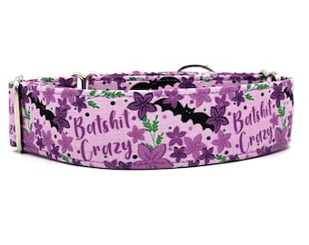 May include: A purple and black dog collar with a floral pattern and the text "Bats*** Crazy".