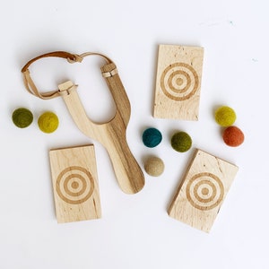Wool Mob's Wood Slingshot Targets are handmade from sustainably harvested Maple wood and laser engraved with a three ringed target image.