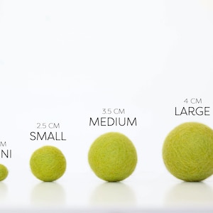 Comparison of Wool Mob's Mini, Small, Medium, and Large felt balls to one another. The color shown is Glow or a bright green.