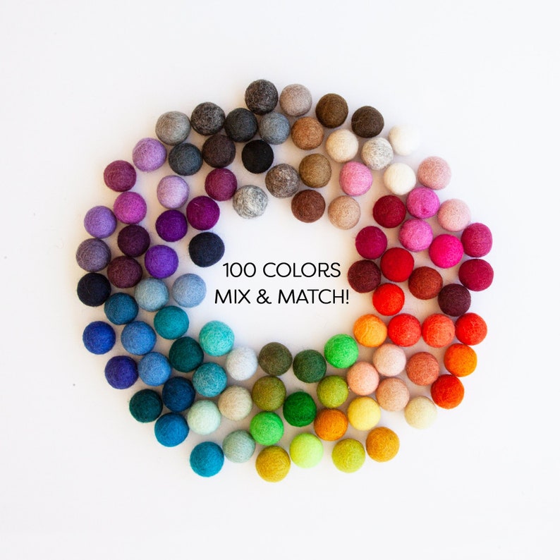 Wool Mob's mini felt balls come in 100 ready to ship colors. Each measures roughly 1 cm or 0.4 inches in diameter.
