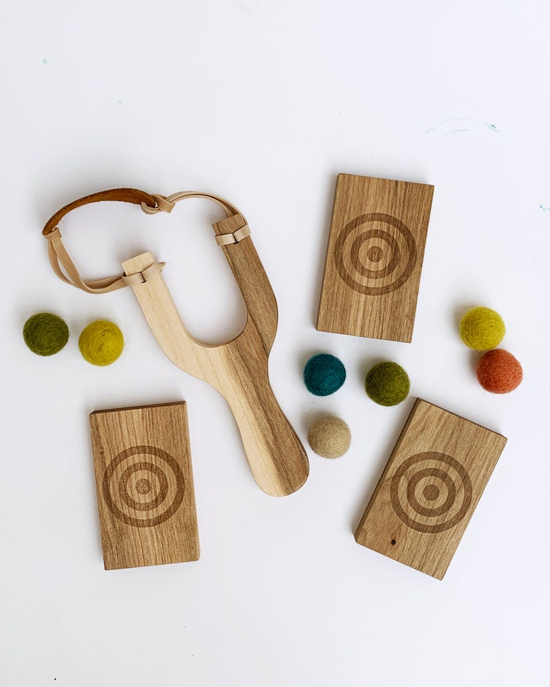 Wool Mob's Wood Slingshot Targets are handmade from sustainably harvested Maple wood and laser engraved with a three ringed target image.