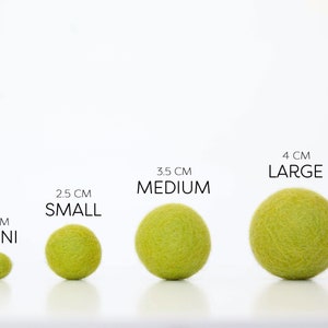 Comparison of Wool Mob's Mini, Small, Medium, and Large felt balls to one another. The color shown is Glow or a bright green.