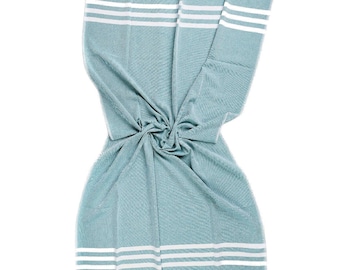 May include: A light blue beach towel with white stripes. The towel is made of cotton and has a fringed edge.