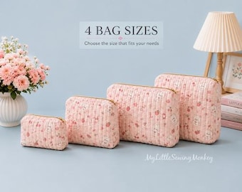 May include: Four quilted pouches in varying sizes, each featuring a light pink fabric with a small floral and animal print, gold-tone zippers, and vertical stitching. The text 4 BAG SIZES Choose the size that fits your needs is visible above.