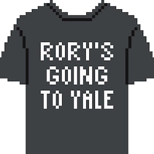 May include: Dark gray t-shirt with the text "RORY'S GOING TO YALE" in white block letters. The shirt has short sleeves and a crew neck. The design is a pixelated graphic.
