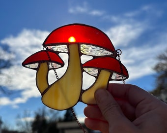 Mushroom stained glass sun catcher with copper chain and patina, 5” wide by 4” tall