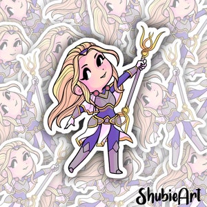 May include: A sticker featuring a cartoon illustration of a female character with long blonde hair, wearing purple and white armour, holding a golden staff. The character is in a dynamic pose, with her arm raised and her staff pointed upwards. The sticker has a white background and a pink outline.