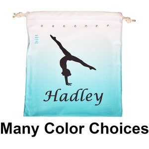 May include: A turquoise and white drawstring bag with a silhouette of a gymnast doing a back handspring. The bag has the name "Hadley" printed on it in black cursive font.  Many Color Choices.
