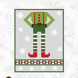 Puede incluir: Un patrón de acolchado para un elfo de Navidad, con una camisa verde, un gorro rojo, pantalones verdes y calcetines a rayas blancas y verdes. El patrón se llama "Be An Elf" y es de Sew A Story. El tamaño terminado es de 48 pulgadas por 62 pulgadas.