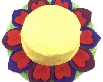 Flower sun hat for kids and adults. Flower petals around center. Lots of fun and great sun protection from summer sun. Unique and only here.