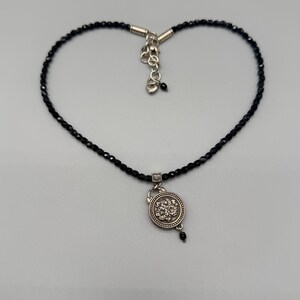 May include: A distressed wooden sign, reading "Welcome to our home" in white. The sign has a rustic finish, ideal for adding a welcoming touch to any home's entrance.