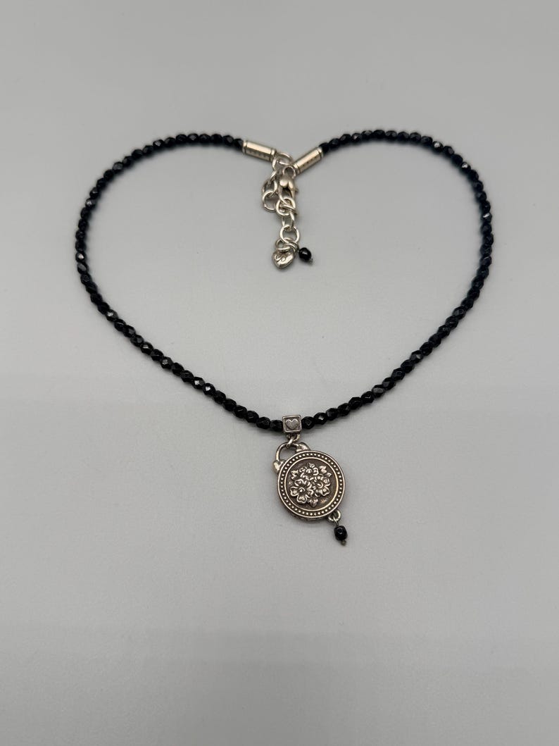 May include: A distressed wooden sign, reading "Welcome to our home" in white. The sign has a rustic finish, ideal for adding a welcoming touch to any home's entrance.