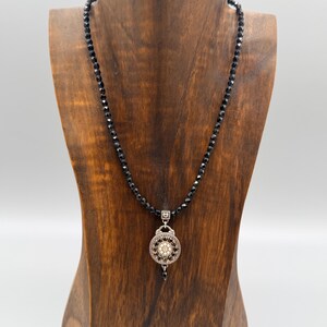 May include: A set of three ceramic mugs with a speckled, matte finish in cream, light grey, and dark grey. Each mug has a simple, minimalist design and a rounded handle.