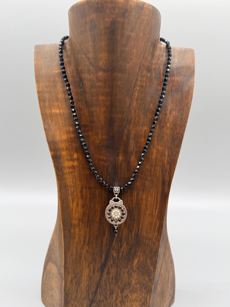 May include: A set of three ceramic mugs with a speckled, matte finish in cream, light grey, and dark grey. Each mug has a simple, minimalist design and a rounded handle.