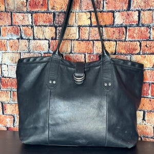 Vintage Lucky Brand Black Leather Tote with multiple sections and magnetic closure
