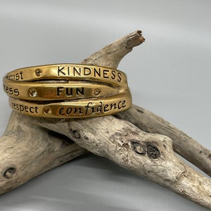 Gold tone inspiration cuff bracelet