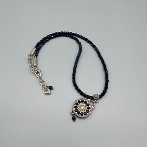 May include: A rustic wooden sign with the text "Welcome to our home" in white lettering. The sign has a distressed finish and a simple, inviting design, ideal for a front porch or hallway.