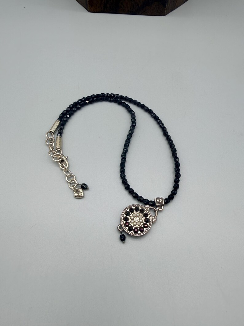 May include: A rustic wooden sign with the text "Welcome to our home" in white lettering. The sign has a distressed finish and a simple, inviting design, ideal for a front porch or hallway.