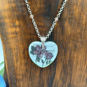 May include: A set of three ceramic vases in varying heights and shapes. The vases are glazed in a matte white finish, offering a minimalist aesthetic. The tallest vase is approximately 10 inches high.