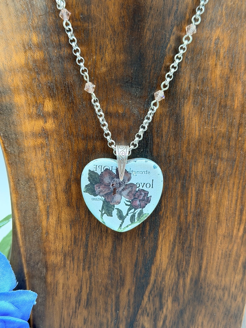 May include: A set of three ceramic vases in varying heights and shapes. The vases are glazed in a matte white finish, offering a minimalist aesthetic. The tallest vase is approximately 10 inches high.